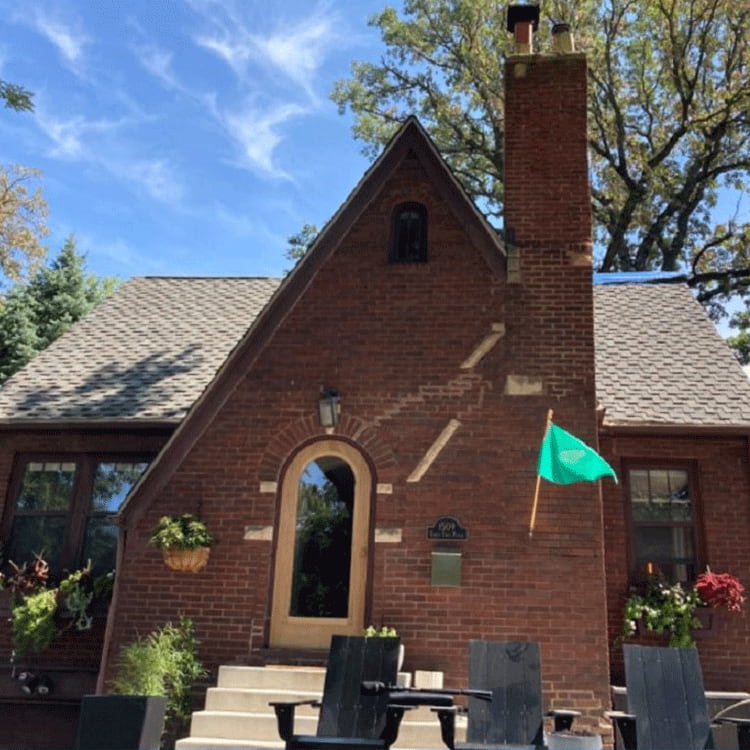 a small tudor home exterior before renovations