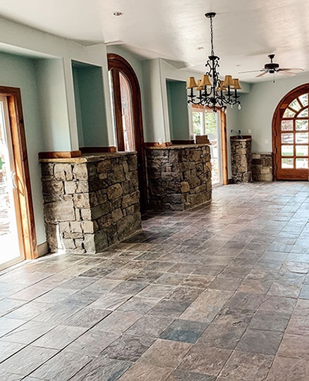 Empty dining room with outdated patio doors.