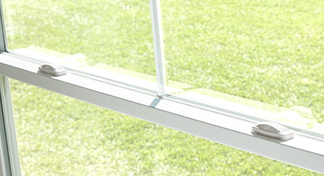sash lifts for a white double-hung window