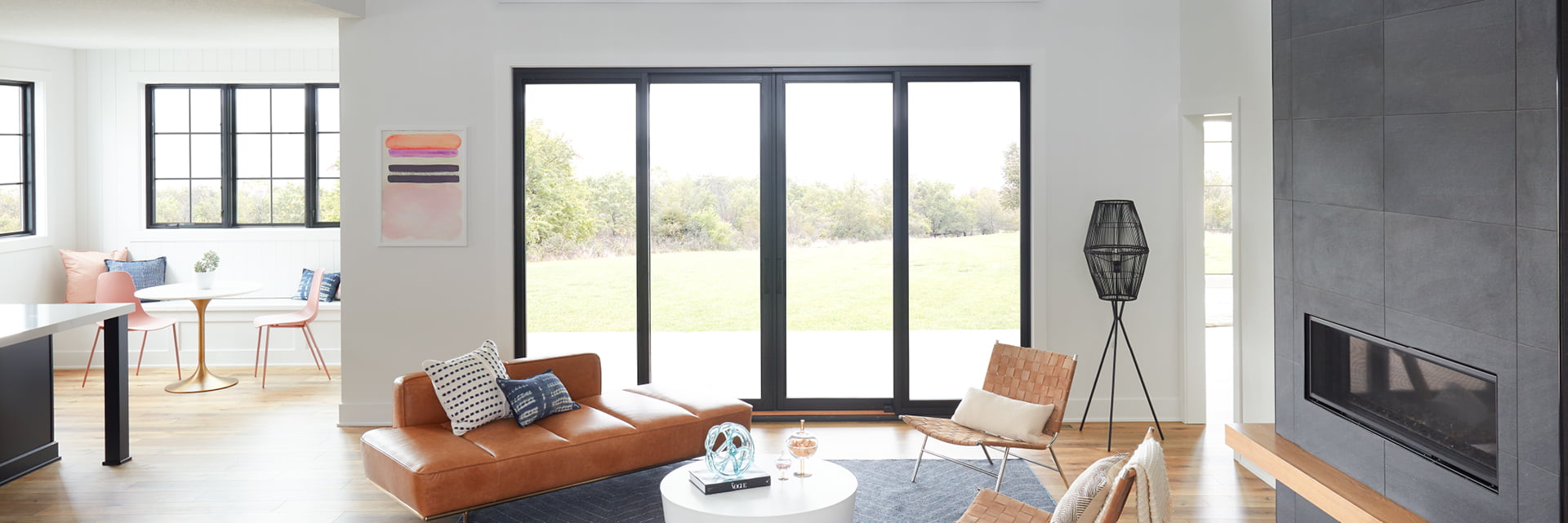 expansive living room with lifestyle windows and sliding doors