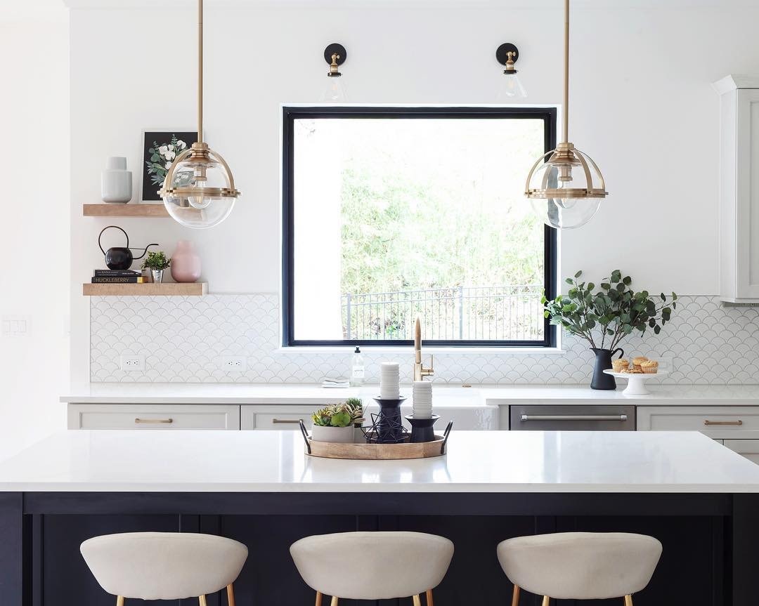 bar stools pulled up to kitchen island overlooking large picture window